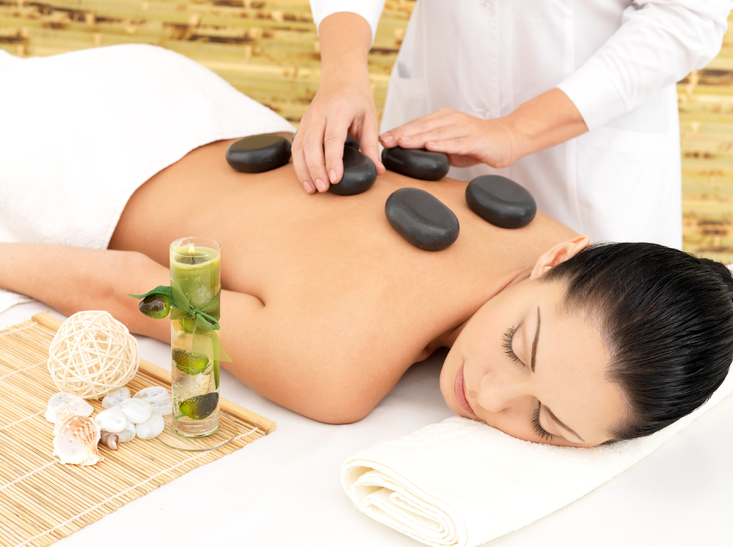 Woman Having Hot Stone Massage  