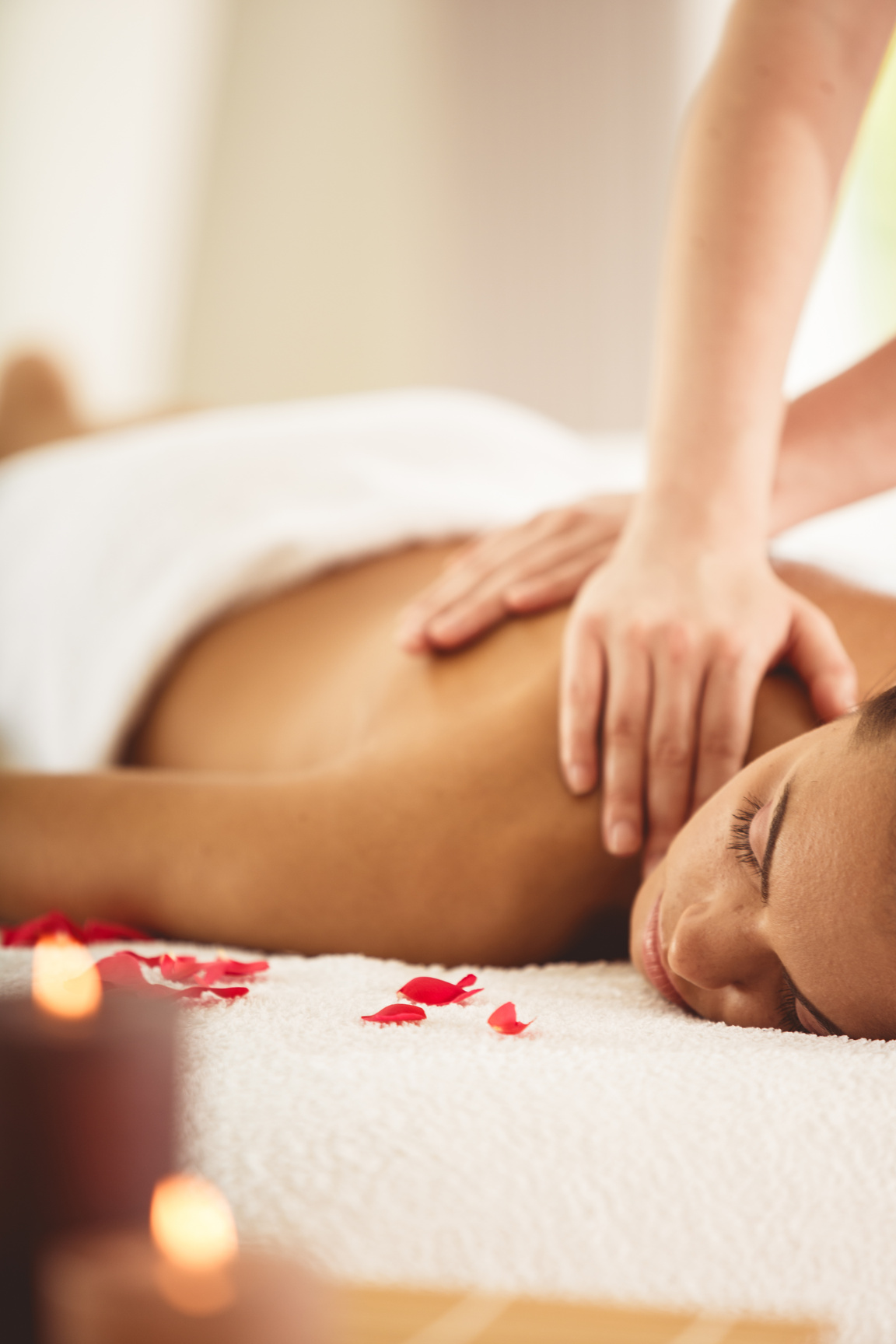 Woman receiving relaxing massage at spa
